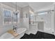 Modern bathroom featuring a glass shower, tiled walls, and elegant vanity at 3608 Buzzard Rd, Wendell, NC 27591