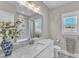 Bathroom with a vanity, large mirror, and luxurious finishes at 3608 Buzzard Rd, Wendell, NC 27591