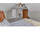 Bedroom displays an open doorway, a wooden armoire, and a charming bed with blue floral accents at 3608 Buzzard Rd, Wendell, NC 27591