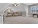 Large bonus room with a wet bar, a sectional sofa, vaulted ceilings and multiple windows at 3608 Buzzard Rd, Wendell, NC 27591