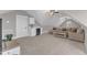 Large bonus room with a wet bar, a sectional sofa, vaulted ceilings and multiple ceiling fans at 3608 Buzzard Rd, Wendell, NC 27591