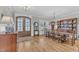 Bright dining room with a large table and a display cabinet showcasing decorative plates at 3608 Buzzard Rd, Wendell, NC 27591