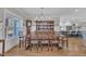 Dining room with a large table and a hutch, with an open view of the kitchen at 3608 Buzzard Rd, Wendell, NC 27591