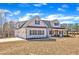 Elegant two-story home with an attached garage, pristine white siding, and a well-maintained front lawn at 3608 Buzzard Rd, Wendell, NC 27591