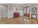 Welcoming foyer with hardwood floors, wainscoting, and elegant decor, offering a warm and inviting entrance at 3608 Buzzard Rd, Wendell, NC 27591