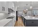 Kitchen featuring stainless appliances, white cabinetry, and a large center island with a white countertop at 3608 Buzzard Rd, Wendell, NC 27591