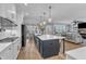 Open kitchen with stainless appliances, large island, and open to dining and living area at 3608 Buzzard Rd, Wendell, NC 27591