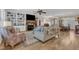 Inviting living room with a fireplace, built-in shelves, and a view into dining room at 3608 Buzzard Rd, Wendell, NC 27591