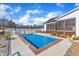 In-ground swimming pool with patio, lounge chairs, and privacy fence at 3608 Buzzard Rd, Wendell, NC 27591