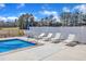 Backyard featuring an in-ground swimming pool with lounge chairs and patio seating at 3608 Buzzard Rd, Wendell, NC 27591