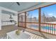 Relaxing outdoor screened-in porch with summer kitchen and a view of the refreshing backyard pool at 3608 Buzzard Rd, Wendell, NC 27591