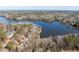 Aerial view shows the neighborhood with lake access, lots of mature trees, and winding roads at 365 Shawnee Dr, Louisburg, NC 27549