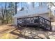 Quaint backyard with a cozy deck perfect for entertaining and peaceful relaxation at 365 Shawnee Dr, Louisburg, NC 27549