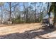 View of a large, cleared backyard, ready for outdoor activities and landscaping in a natural setting at 365 Shawnee Dr, Louisburg, NC 27549