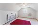 Upstairs bedroom with a window AC unit and plush carpet with a partial red rug at 365 Shawnee Dr, Louisburg, NC 27549