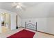 Upstairs bedroom with a window with plush carpet and a partial red rug at 365 Shawnee Dr, Louisburg, NC 27549