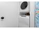 Dedicated laundry space with stacked washer and dryer at 365 Shawnee Dr, Louisburg, NC 27549