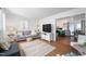 Bright living room featuring stylish furniture, hardwood floors, and an open concept design at 365 Shawnee Dr, Louisburg, NC 27549