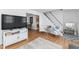 Spacious and bright living room showcasing hardwood floors, modern furnishings, and ample natural light at 365 Shawnee Dr, Louisburg, NC 27549