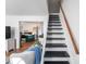 Stairway access to second level with views to the kitchen and adjacent living spaces at 365 Shawnee Dr, Louisburg, NC 27549