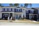 Attractive new construction townhomes featuring varying color schemes and welcoming front porches at 3725 Rosebush Dr, Zebulon, NC 27597