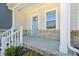 Inviting front porch with stylish brick accents, offering a warm welcome at 3725 Rosebush Dr, Zebulon, NC 27597