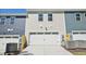A neat two-car garage is displayed in front of the home's facade at 3725 Rosebush Dr, Zebulon, NC 27597