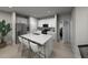 Modern kitchen features stainless appliances, island with seating and white cabinets at 3727 Rosebush Dr, Zebulon, NC 27597