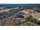 Scenic aerial view of a home surrounded by forest and fields, revealing an idyllic countryside setting at 3817 Nc-119, Mebane, NC 27302