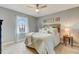Calm bedroom with a ceiling fan, neutral tones, a window, and comfortable bedding at 3817 Nc-119, Mebane, NC 27302