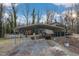 Driveway and carport showcasing the property's outdoor amenities and access with the home in the background at 3817 Nc-119, Mebane, NC 27302