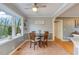 Cozy dining area with wood table, a ceiling fan, and lots of natural light at 3817 Nc-119, Mebane, NC 27302