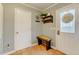 Welcoming entryway featuring a wood bench, storage, and a bright exterior door at 3817 Nc-119, Mebane, NC 27302