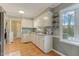 Bright kitchen with white cabinets, granite countertops, and a stainless steel refrigerator at 3817 Nc-119, Mebane, NC 27302