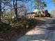 Quaint brick home with a welcoming entrance and lovely landscaping on a sunny day at 402 Willow St, Cary, NC 27511