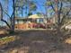 Front view of house showcasing its brick facade, green details and landscaped front yard at 402 Willow St, Cary, NC 27511