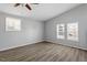Bright bedroom featuring lots of natural light, luxury vinyl plank flooring, and a ceiling fan at 410 N Lamar St, Roxboro, NC 27573