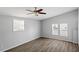 Bedroom featuring a vaulted ceiling, luxury vinyl plank flooring, and lots of natural light at 410 N Lamar St, Roxboro, NC 27573