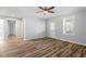 Inviting living room showcasing wood floors and a ceiling fan at 410 N Lamar St, Roxboro, NC 27573