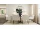 Bright dining room featuring a chandelier, round table, seating for six, and natural light at 4120 Shadbush St, Raleigh, NC 27616