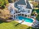 Aerial view of backyard oasis featuring large pool, spa, and lounge area perfect for relaxation at 4708 Wynneford Way, Raleigh, NC 27614