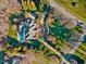 Beautiful estate aerial view with long driveway and mature trees surrounding the property at 4708 Wynneford Way, Raleigh, NC 27614