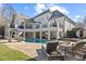 Stunning backyard pool and patio with slide and outdoor seating at 4708 Wynneford Way, Raleigh, NC 27614