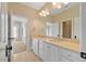 Bathroom with double sink vanity and bright lighting at 4708 Wynneford Way, Raleigh, NC 27614