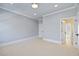 Empty bedroom with neutral carpet and trim at 4708 Wynneford Way, Raleigh, NC 27614
