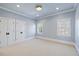 Spacious bedroom with neutral carpet and double windows at 4708 Wynneford Way, Raleigh, NC 27614