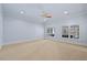 A large bedroom with two big windows and a ceiling fan at 4708 Wynneford Way, Raleigh, NC 27614