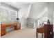 Bedroom with neutral walls, large window, writing desk, and ample natural light at 4708 Wynneford Way, Raleigh, NC 27614