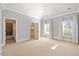 Spacious bedroom with neutral carpet, ensuite bathroom, and window with natural light at 4708 Wynneford Way, Raleigh, NC 27614