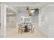 Bright breakfast nook featuring natural light, a mounted TV, and a ceiling fan at 4708 Wynneford Way, Raleigh, NC 27614